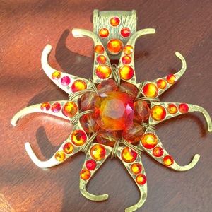 Chico’s orange stone pendant with gold tones